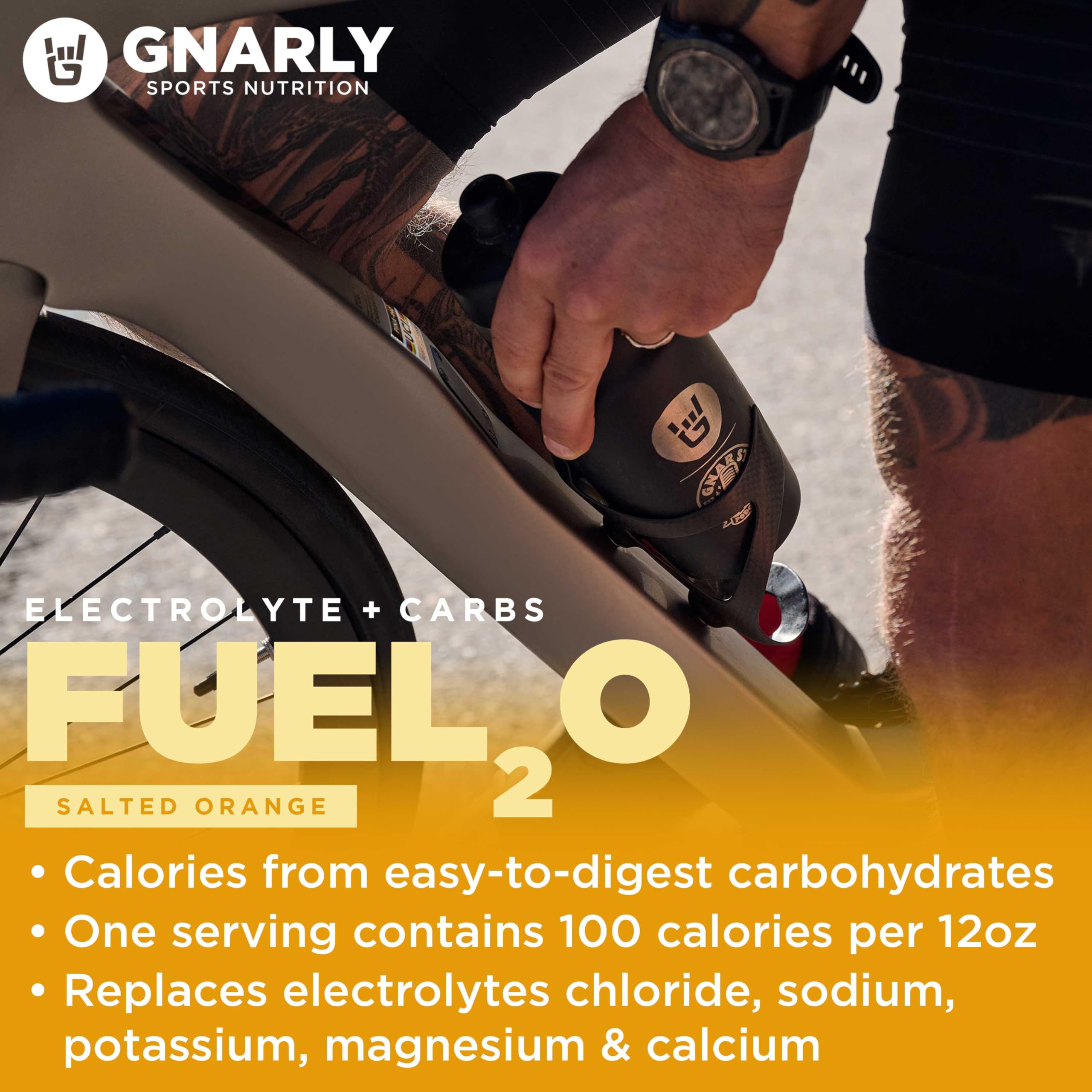 A scoop of Fuel2O Salted Orange Drank beside the tub