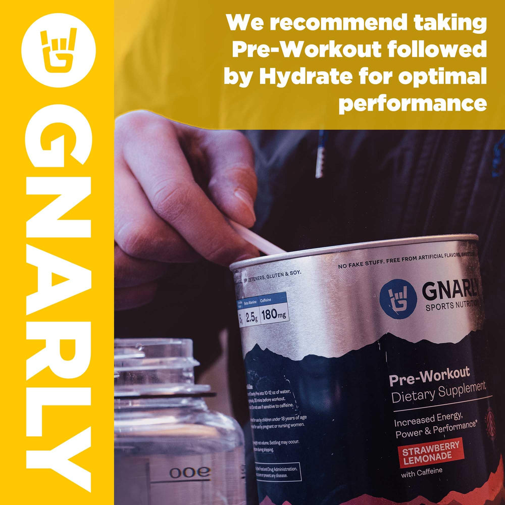 Bottle pouring Gnarly Hydrate Lemonade into water for on-the-go hydration.