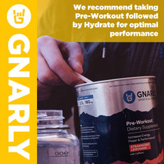 Bottle pouring Gnarly Hydrate Lemonade into water for on-the-go hydration.