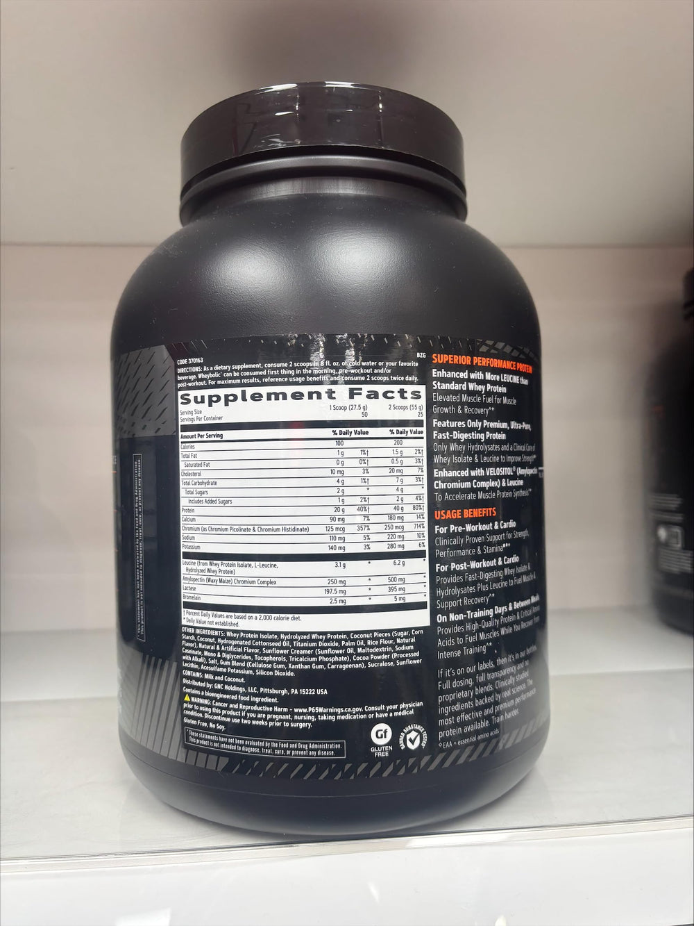 Measuring cup showing powder portion of GNC AMP Wheybolic
