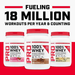 GNC Pro Performance 100% Whey scoop pouring into glass for daily protein
