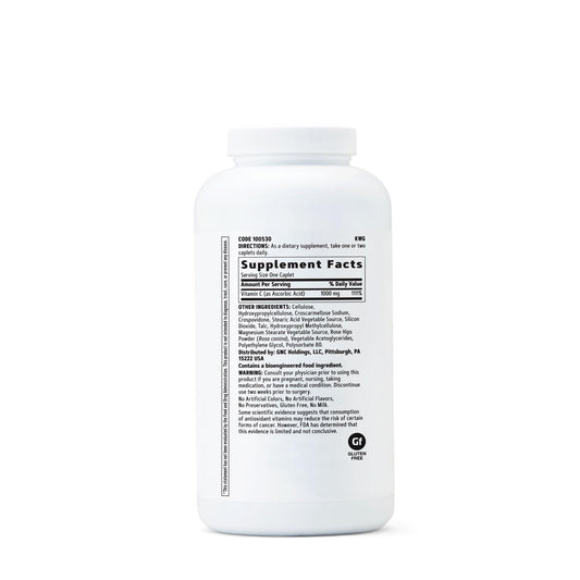 GNC Vitamin C 1000 mg caplets closeup showing vegetarian composition and caplet texture