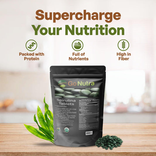 Go Nutra Spirulina tablets poured out showing small vegan tablets for easy daily use.