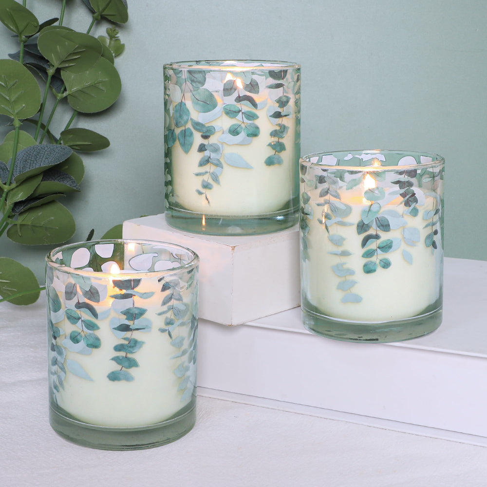 GORGE MOMENT eucalyptus candle with leaf pattern in green glass for calming ambiance.