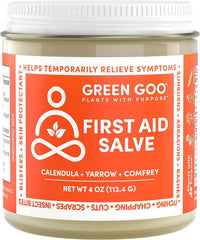 Green Goo First Aid Salve jar close-up showing herbal formula for skin healing.
