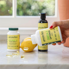 Greens First Omega-3 Optimize bottle on kitchen counter implies daily routine.