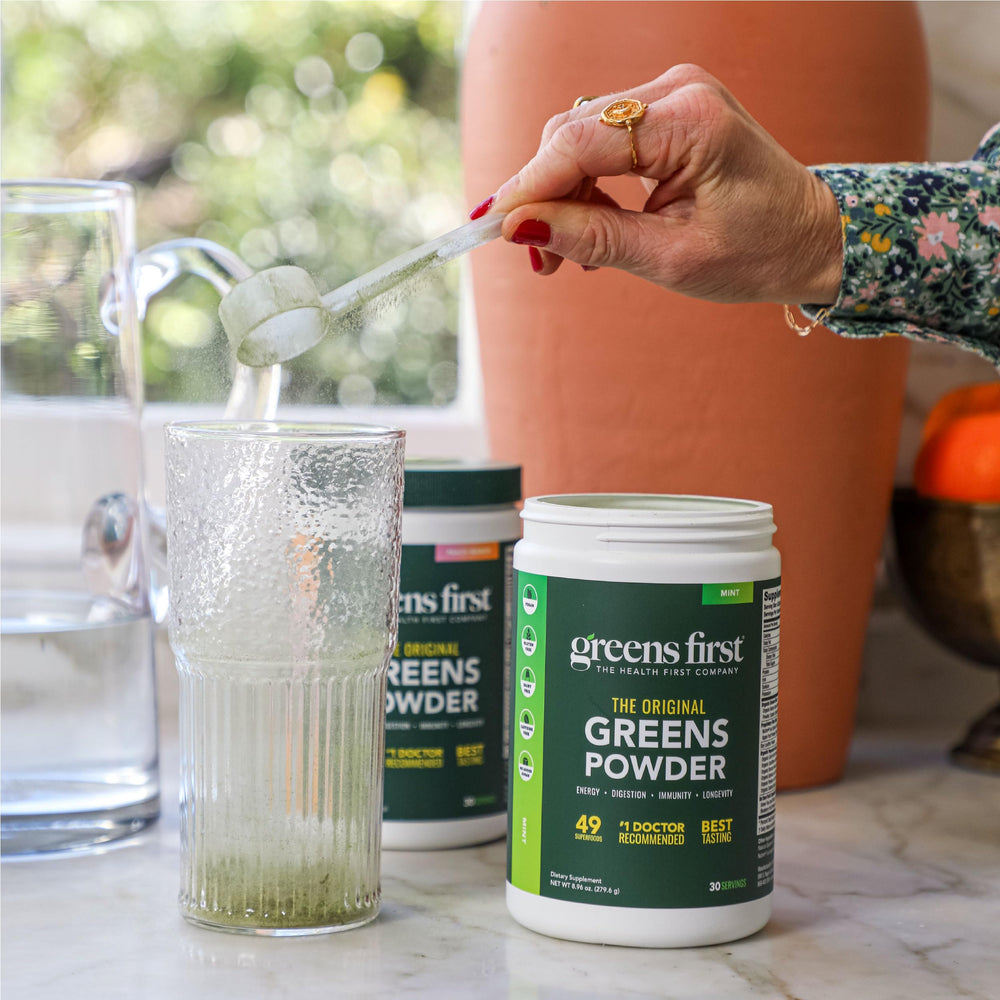 Vibrant green smoothie using Greens First Original Greens Powder.