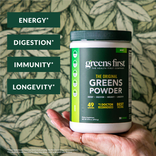 Greens First powder being mixed into water for quick nutrition.