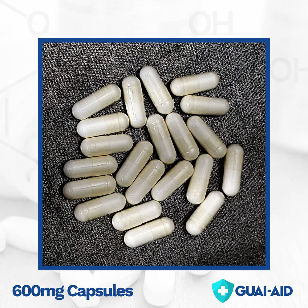 GUAI-AID label closeup shows 500-600mg guaifenesin per capsule.