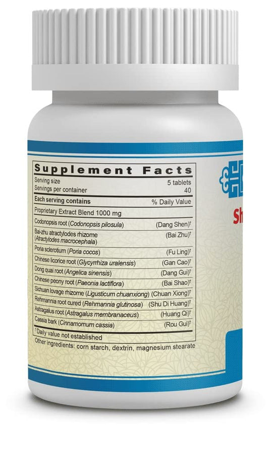 Guang Ci Tang Shi Quan Da Bu Pian tablets closeup with hints of energy support.