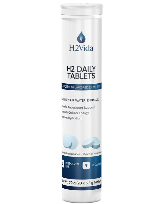 H2Vida hydrogen water tablets bottle close-up for clean hydration on the go.