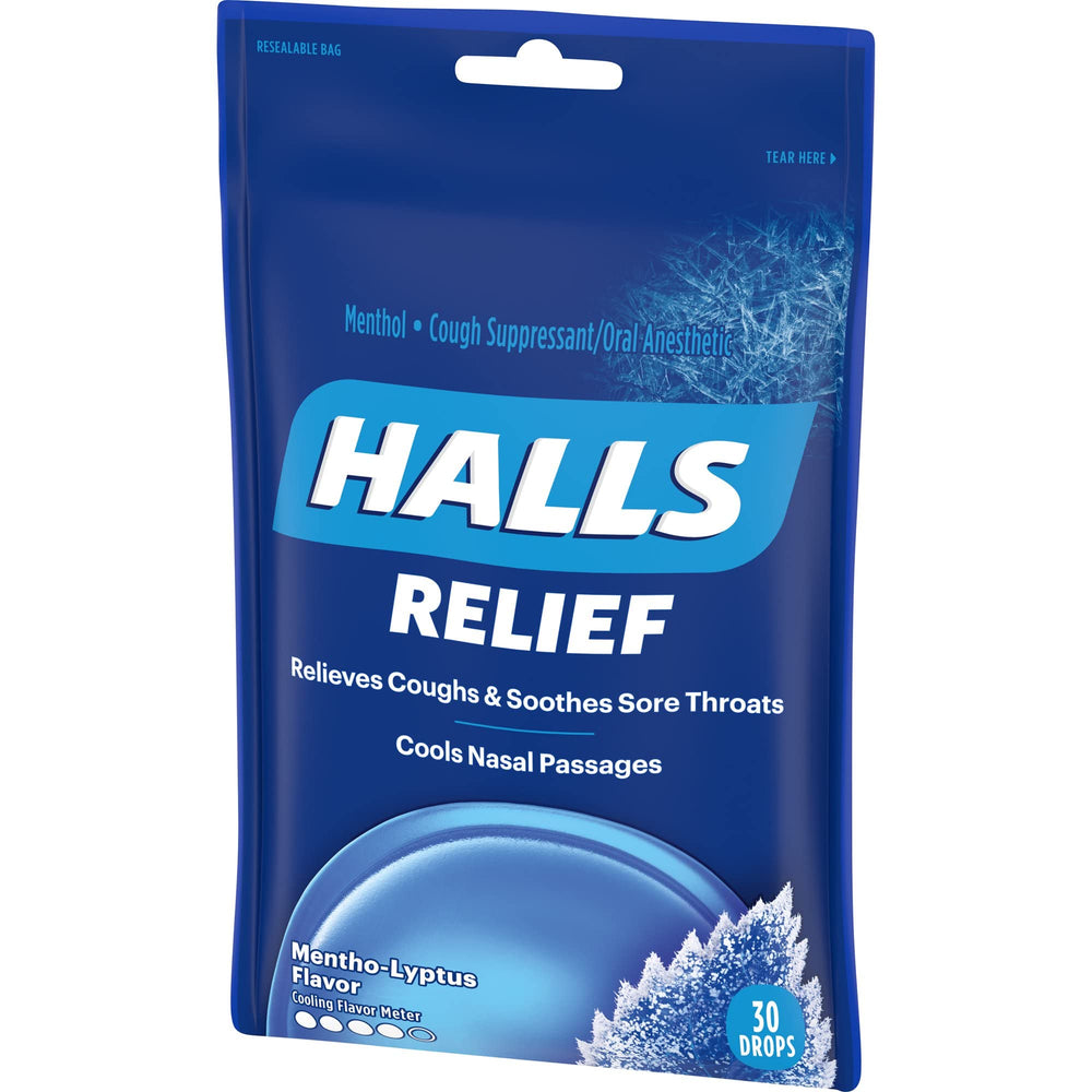 HALLS Mentho-Lyptus drops in hand illustrating portability and immediate relief.