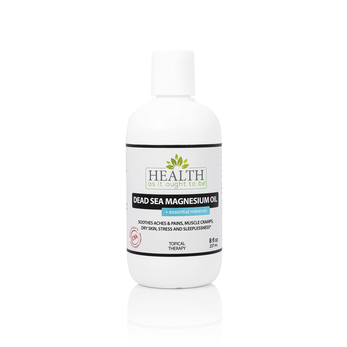 Health As It Ought To Be Dead Sea Magnesium Oil bottle on table promotes daily relaxation.