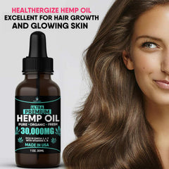 Healthergize hemp oil drops in palm for precise dosing.