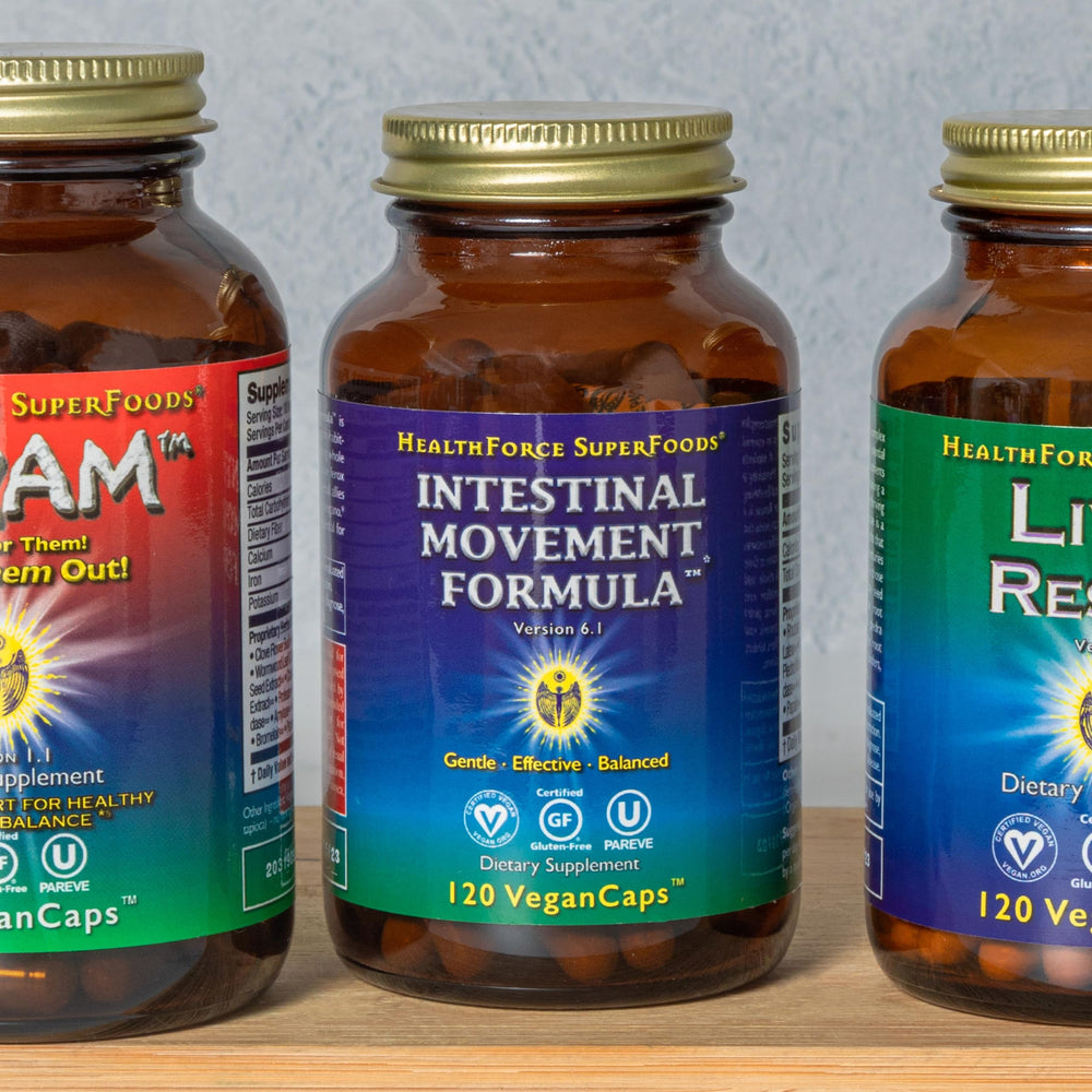 HealthForce SuperFoods capsules arranged for digestive regularity use.
