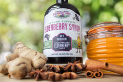Ingredients lineup shows elderberry, honey, ginger, cinnamon, and star anise.