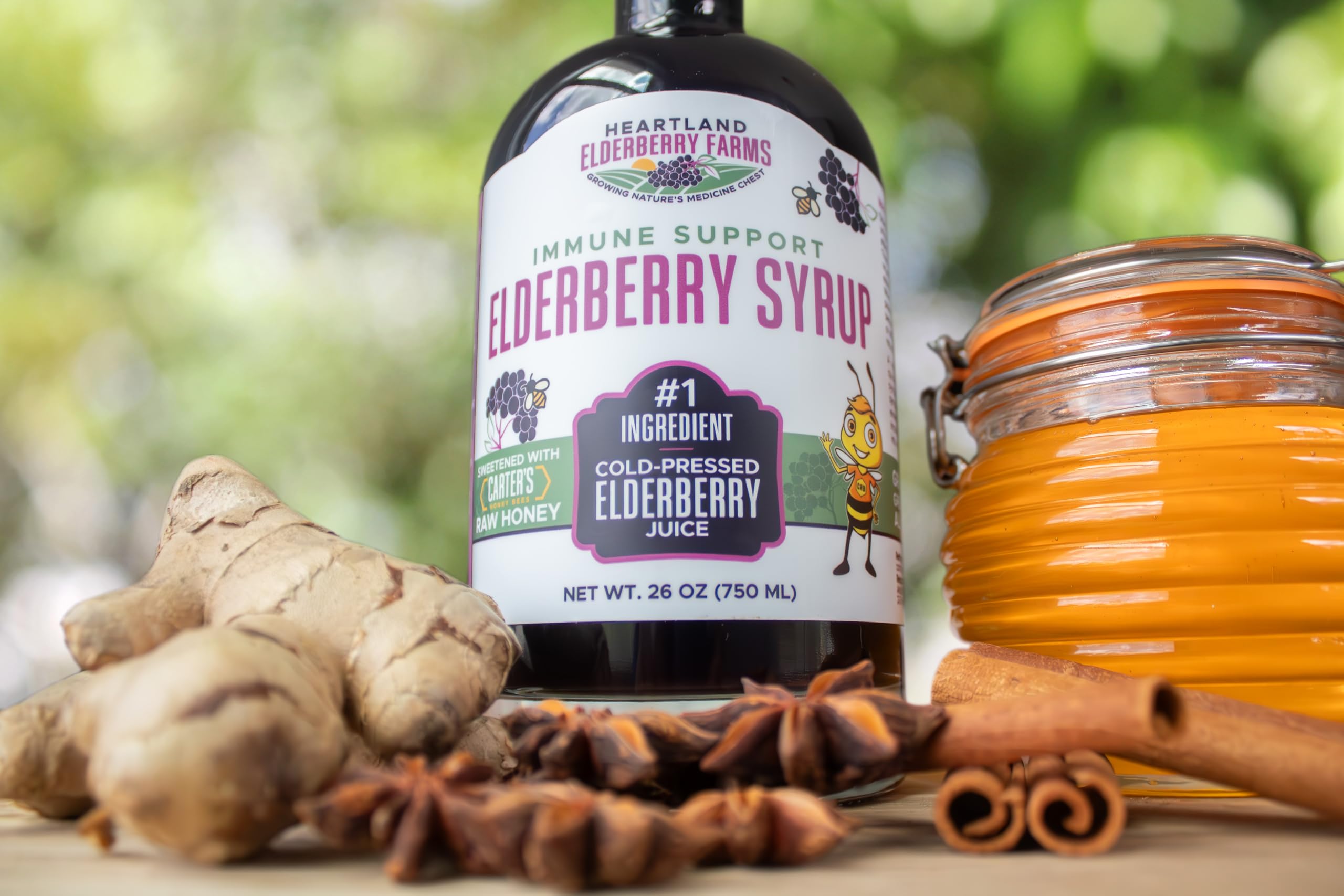 Heartland Elderberry Syrup being pressed process shot.