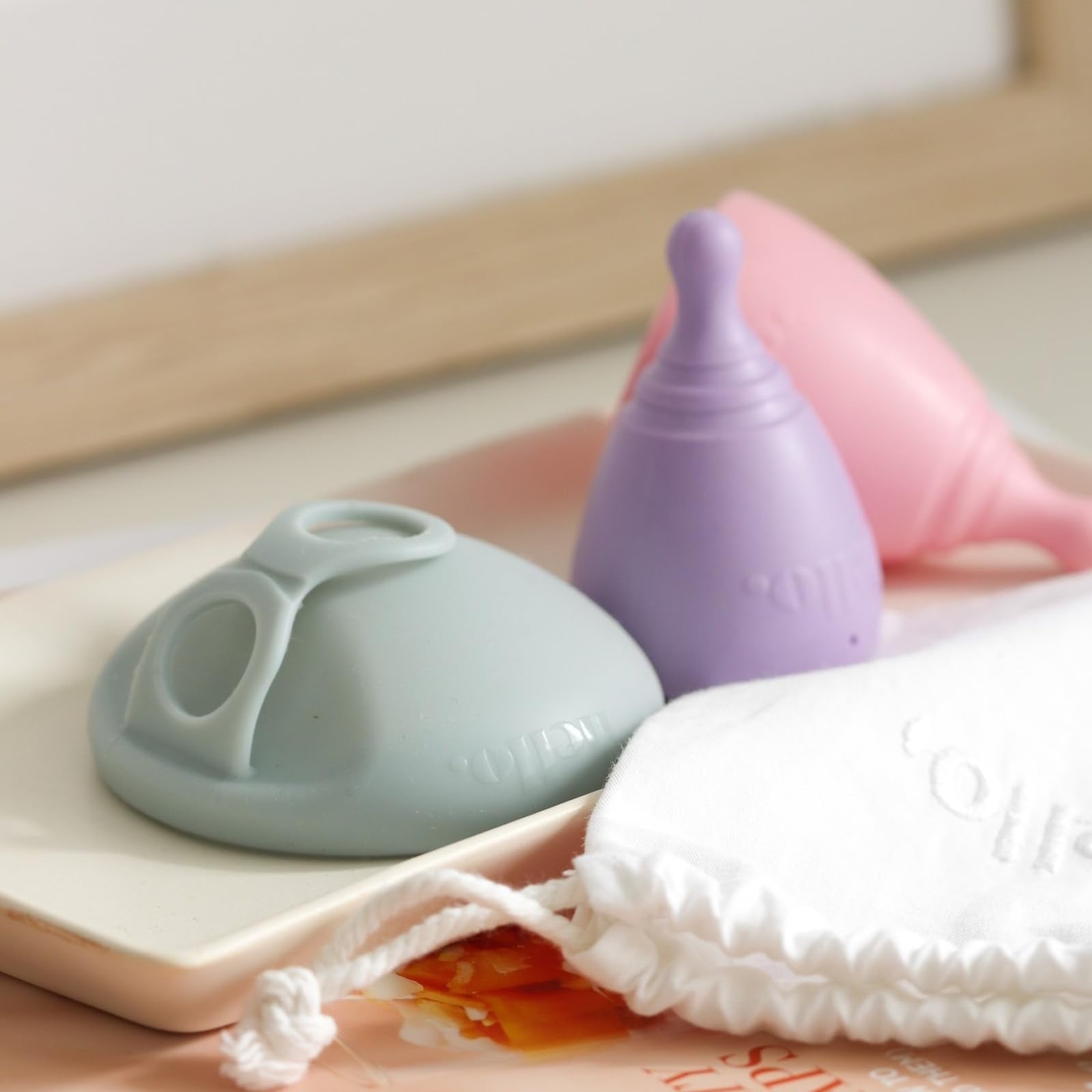 Hello Period average cervix cup removal with stem shows easy insertion and handling.