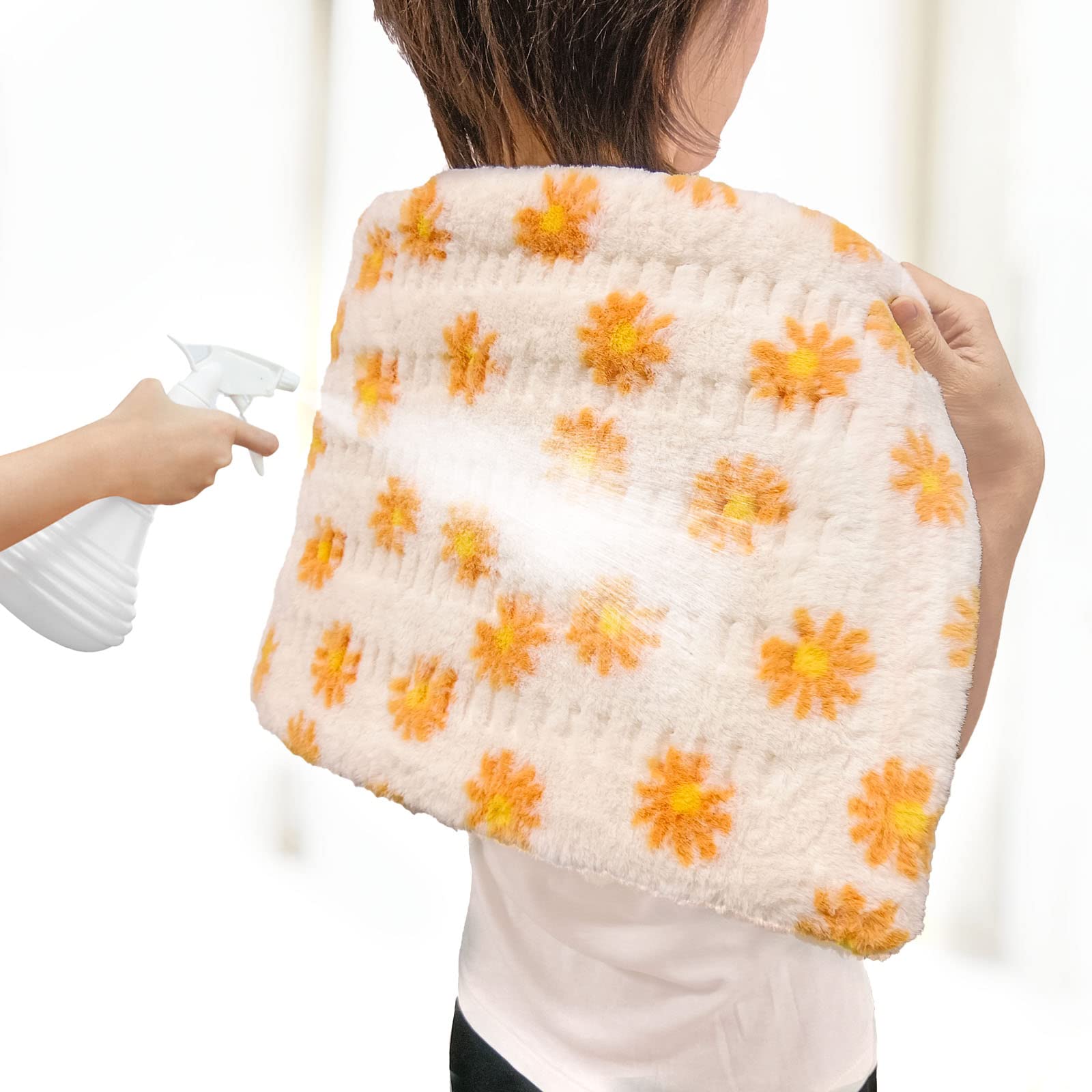 HELLOMOTO heating pad on bed used for relaxing sessions.