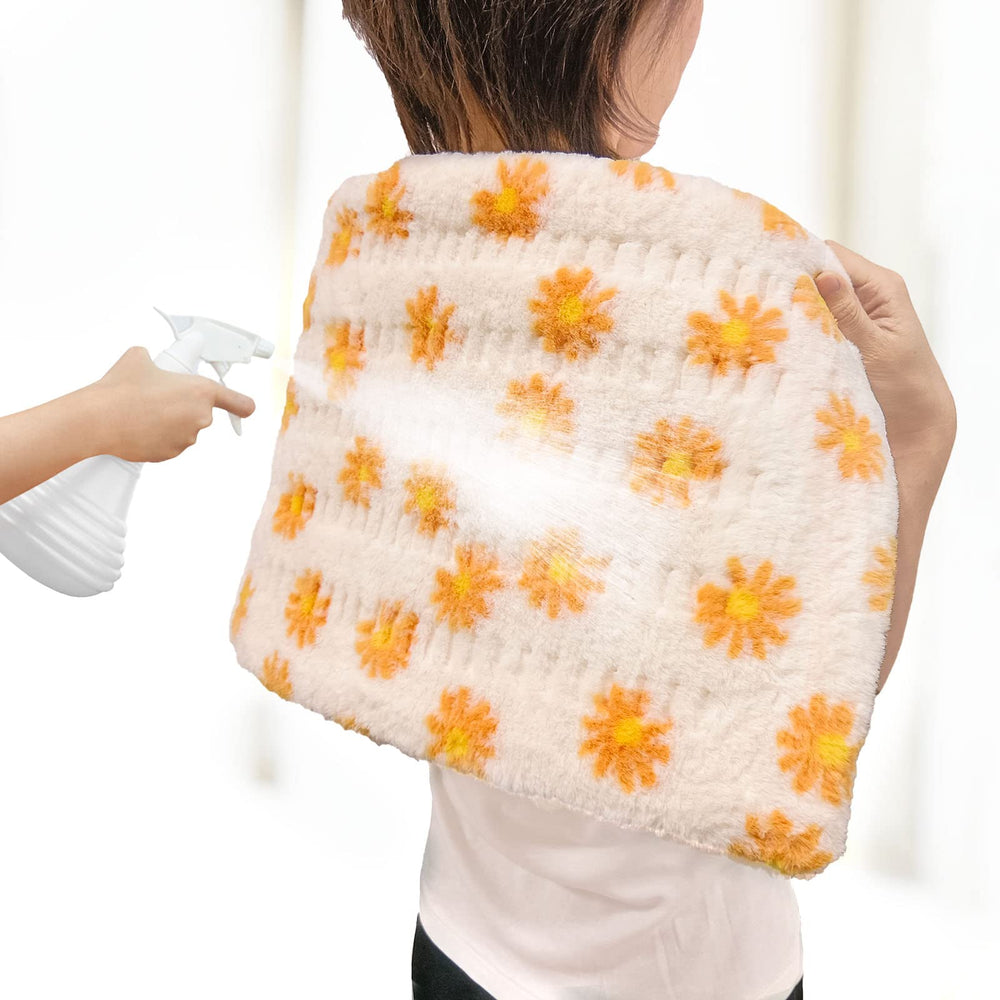 HELLOMOTO heating pad on bed used for relaxing sessions.