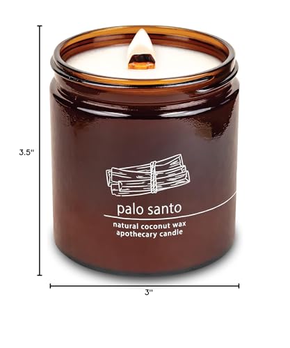 Hemlock Park 16 oz candle burning with warm glow