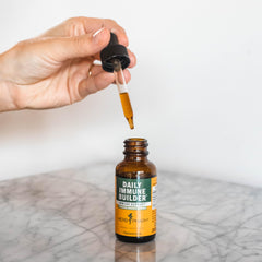 Herb Pharm Daily Immune Builder dropper action demonstrates precise dosing.
