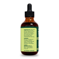 Front view of HERBANA nettle supplement bottle on desk.