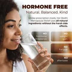 Her Bodhi Meno capsules in hand illustrating convenient daily support.