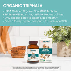 Himalaya Triphala capsules pouring demonstrates easy daily intake for digestive wellness.