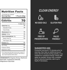 Hand holding HNY+ energy gel for mid-run fueling and quick energy.