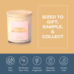 Candle on a dining table setting from Homesick Fresh Bouquet for cozy ambiance.