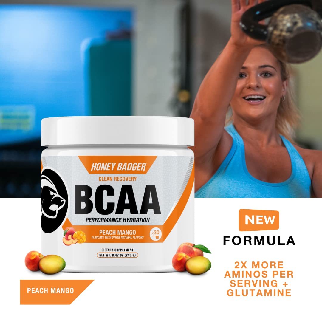 Honey Badger BCAA + EAA mixing glass with Peach Mango flavor for hydration after workouts.