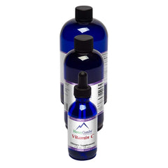 Close-up of the dropper dispensing Vitamin C liquid for easy dosing