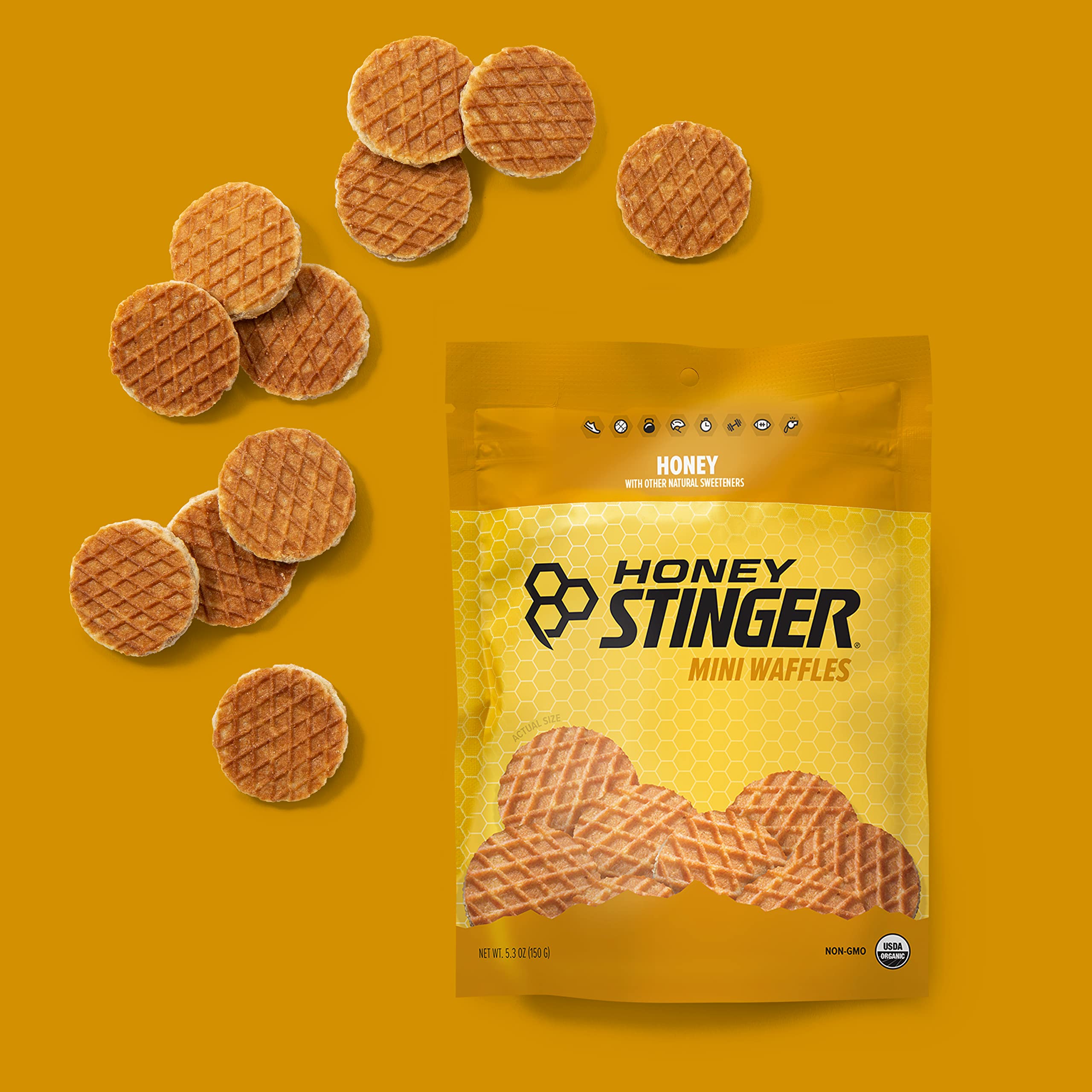 Honey Stinger waffles in gym bag beside water bottle for training.