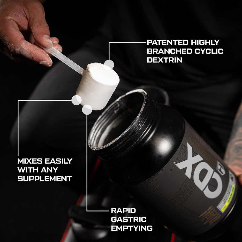 HOSSTILE CDX serving scoop beside jar for easy dosing.