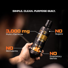 HOSSTILE Liquid L-Carnitine orange blast on a workout table for daily metabolic boost