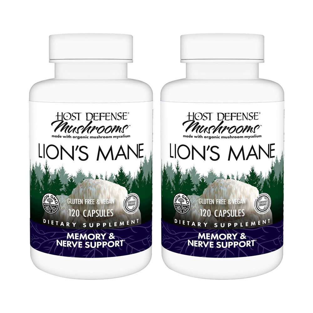 Host Defense Lion's Mane capsules bottle on wood for daily focus support.