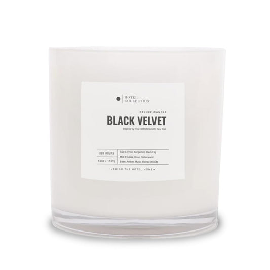 Hotel Collections Black Velvet Deluxe Candle jar glow enhances living room ambiance.