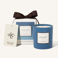 Hotel Lobby Candle: blue skies bottle glows, evoking calm hotel-inspired ambience.