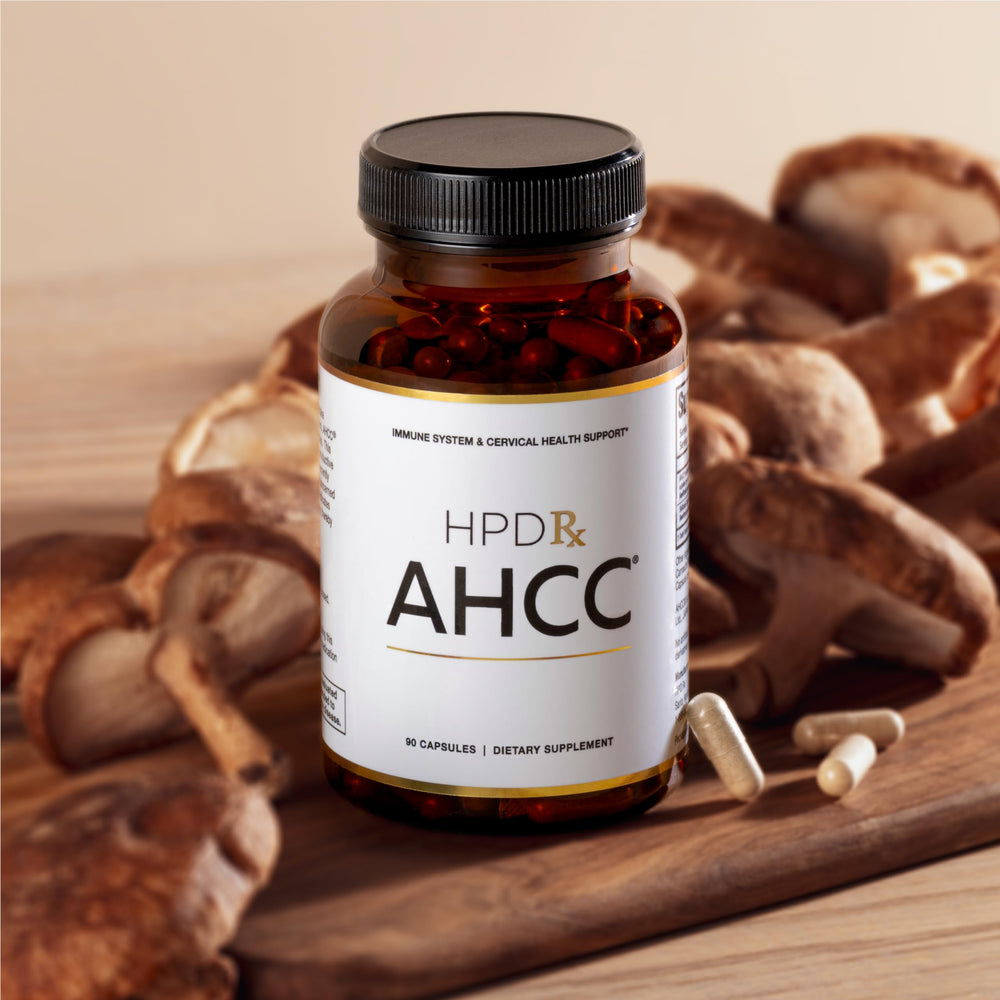 HPD Rx AHCC Shiitake capsules close-up showing a 1100 mg serving.