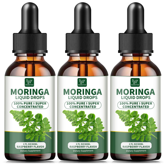 Hudetex Moringa Liquid Drops raspberry bottle on kitchen counter, supporting daily energy.