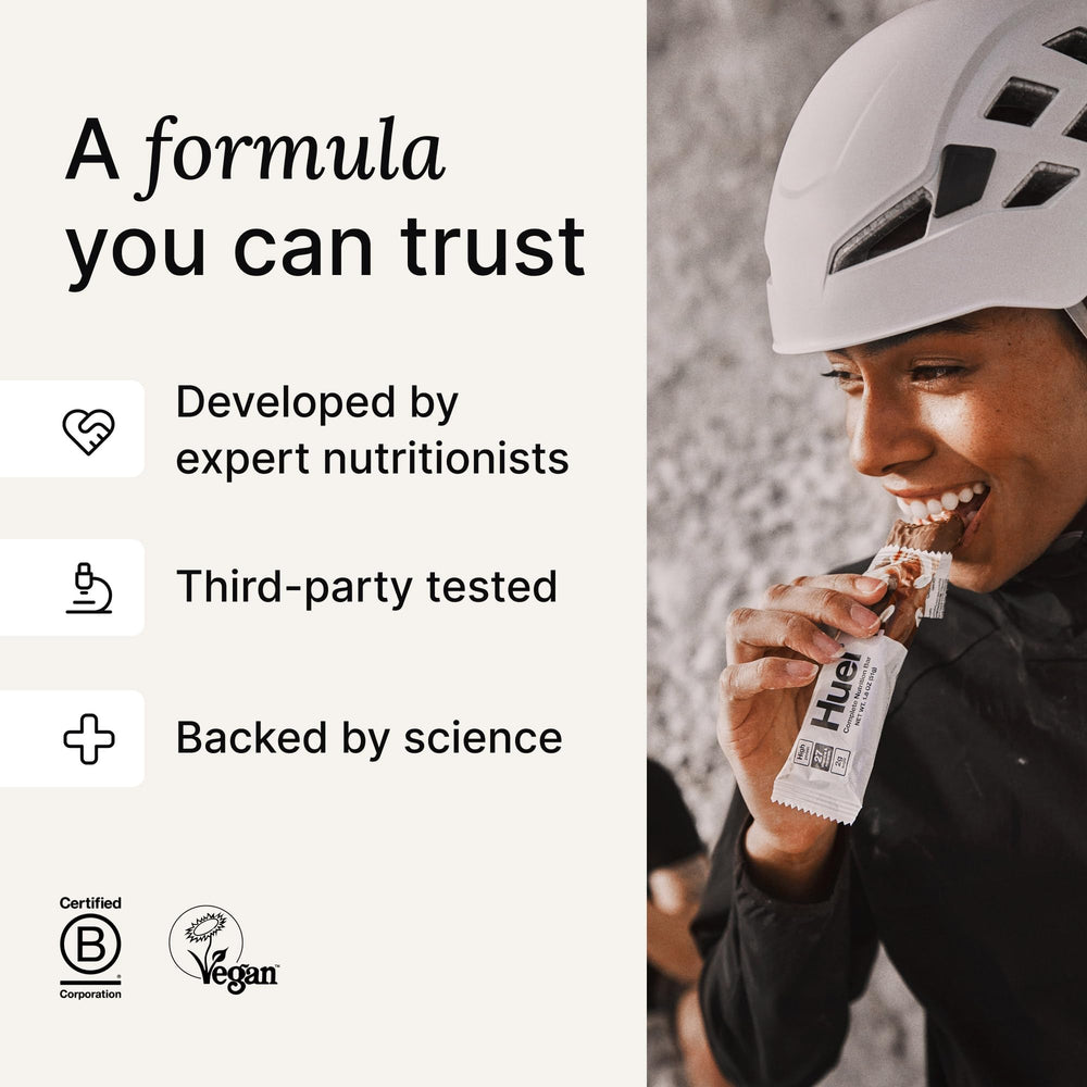 Huel Complete Nutrition bar viewed from the side, rich texture detail.
