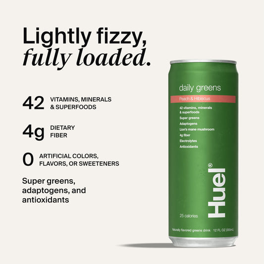 Pouring Huel Daily Greens into a glass for a fruity greens drink