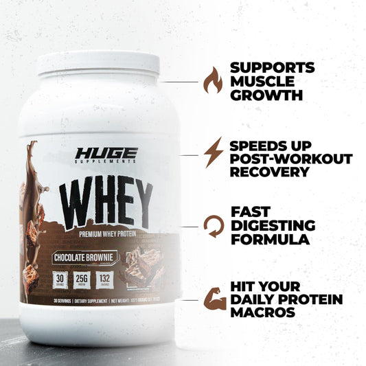 Huge Whey shake in glass illustrating smooth mixability for post-workout recovery.