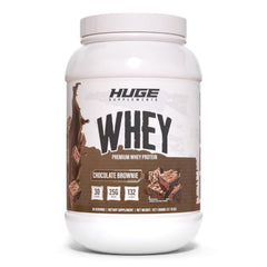Huge Whey Chocolate Brownie tub showing high-protein formula for muscle support.