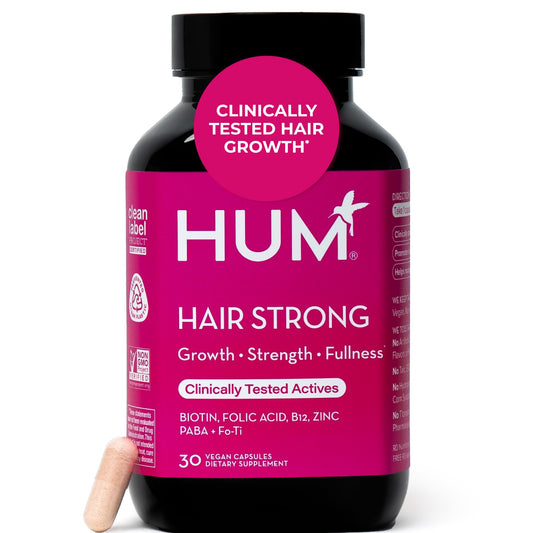 HUM Hair Strong bottle front shows daily vegan capsules for hair wellness.