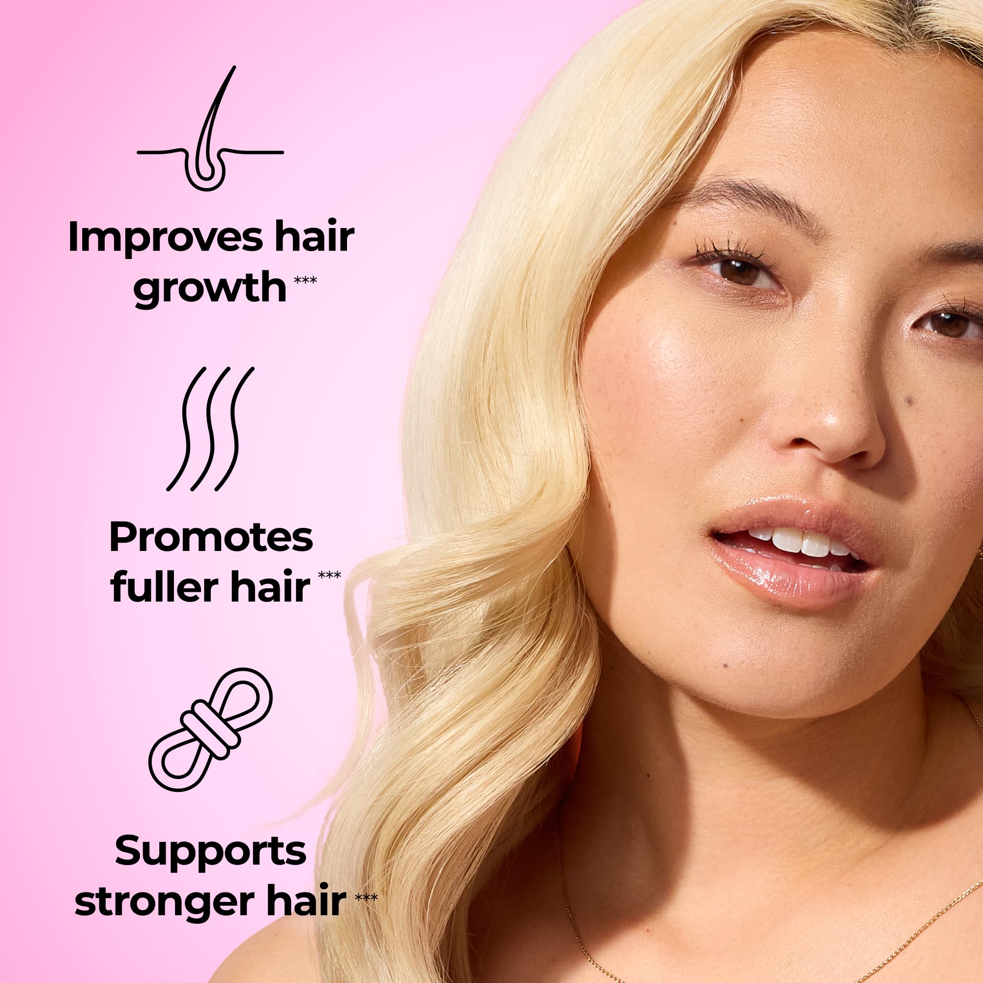 HUM Hair Strong gummies close-up highlighting strawberry flavor and vegan formula.
