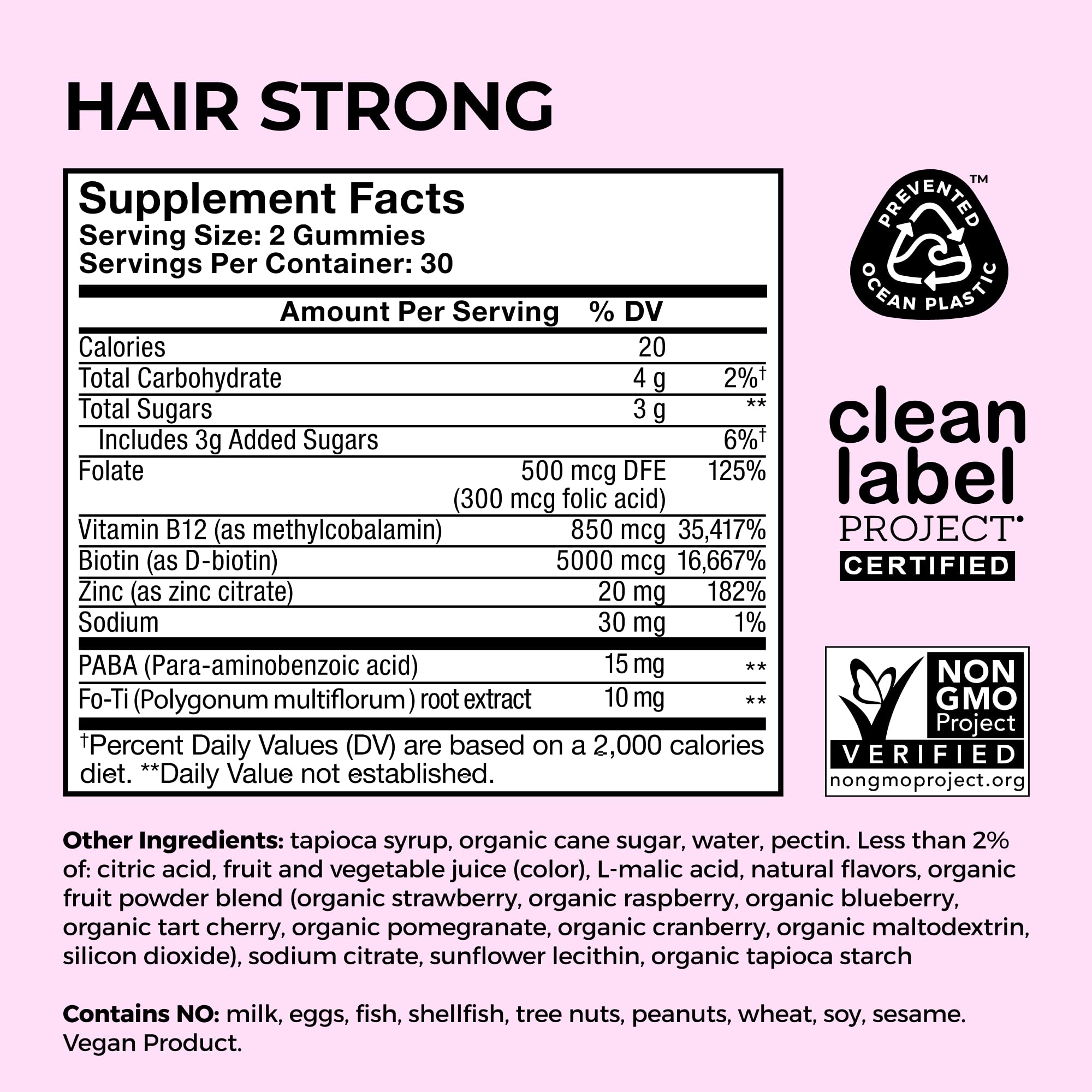 HUM Hair Strong packaging and a tray of gummies on a clean counter.