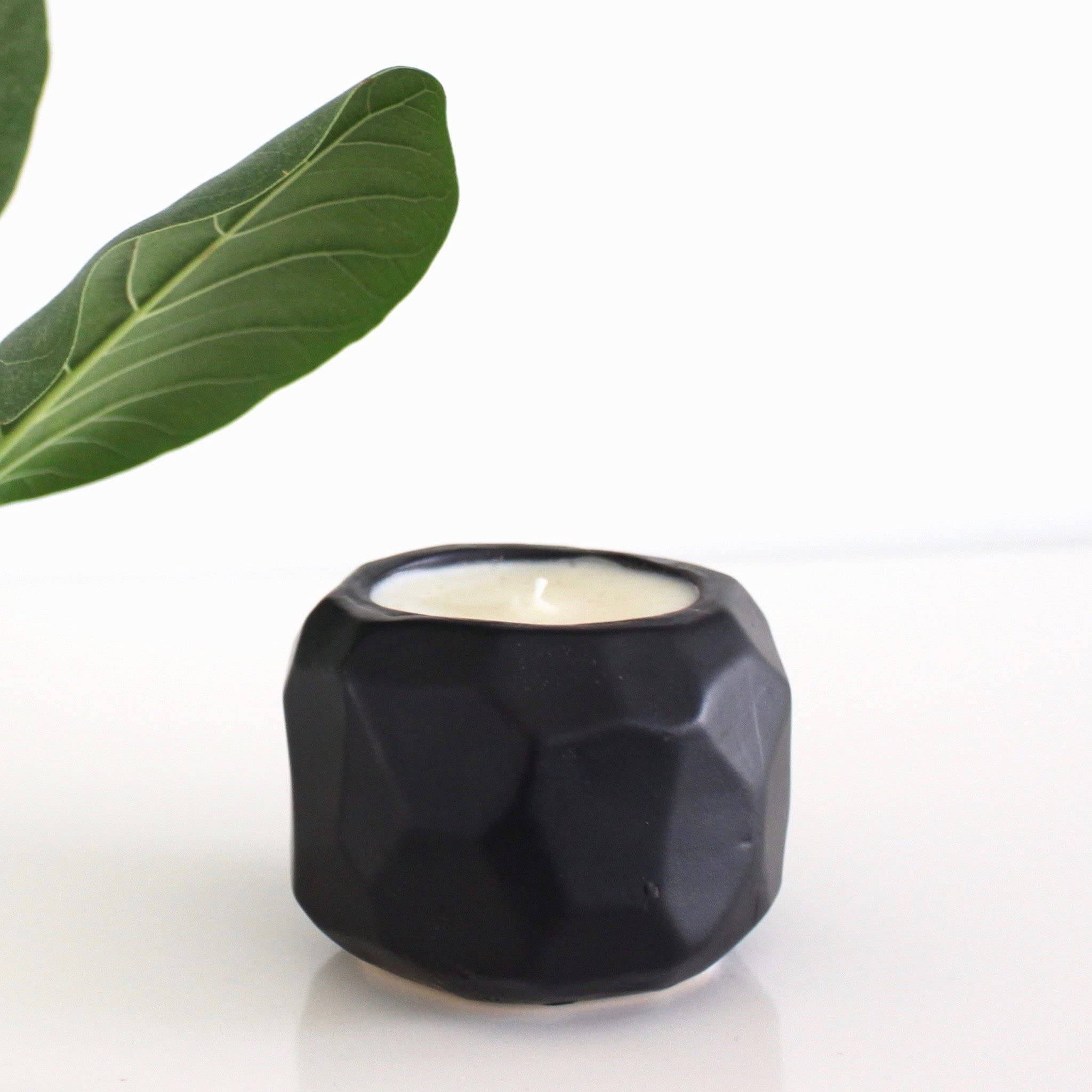 Hyggelight Emma handmade black ceramic container enhances style.
