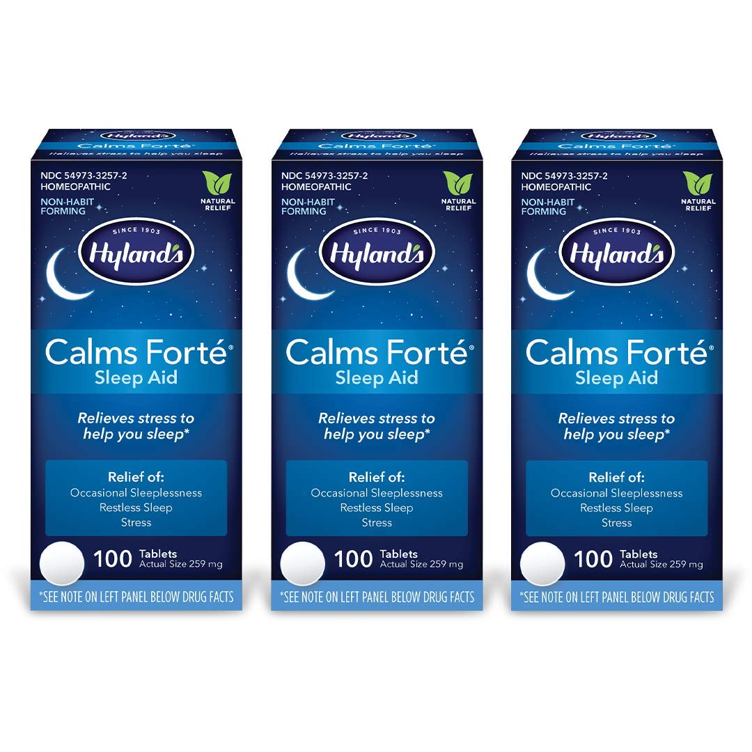 Hyland's Calms Forte sleep aid bottle on nightstand showing natural relief for occasional sleeplessness